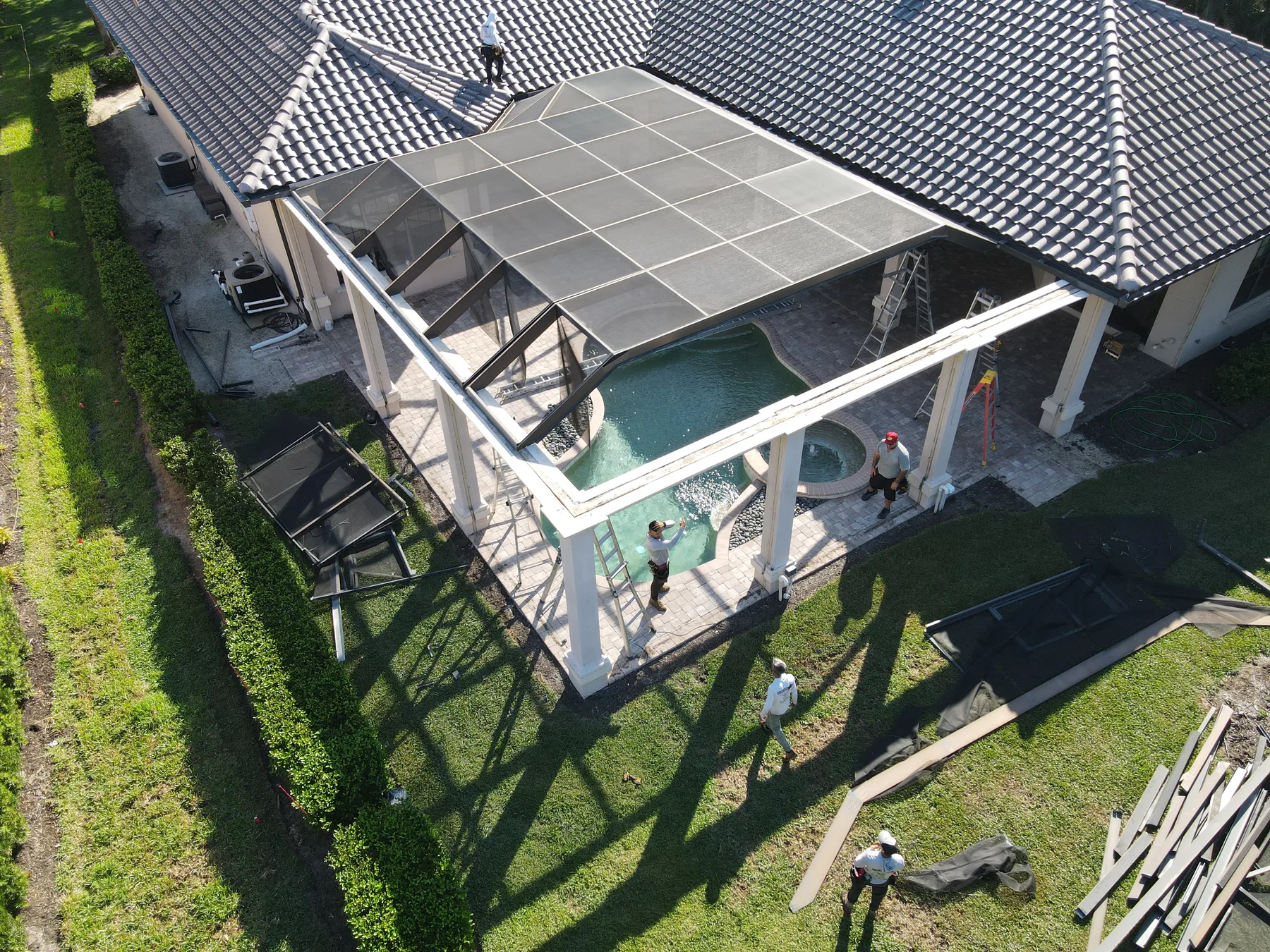 Aerial view of a large pool enclosure installation